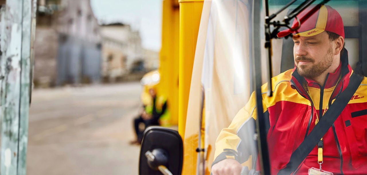 man driving DHL van