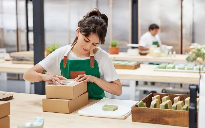 woman preparing a package that may require msds certificate for international shipping