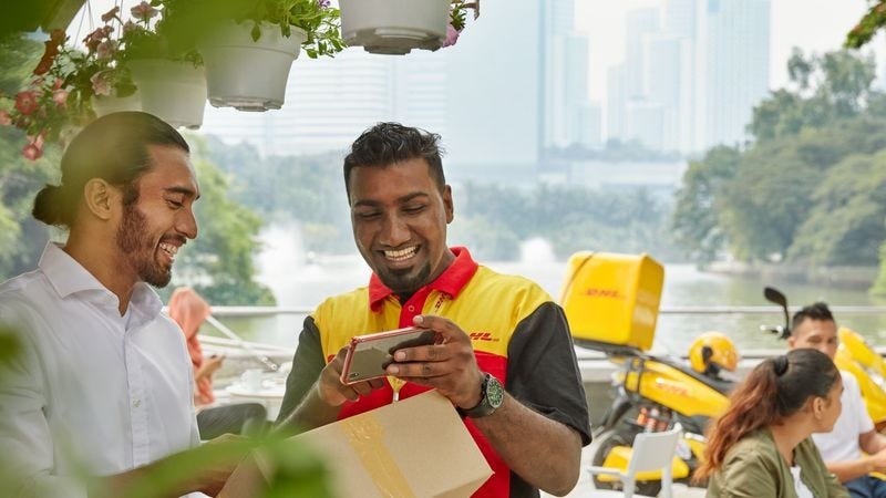 dhl courier verifying package with recipient