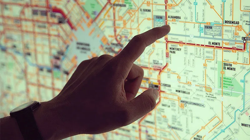 last mile delivery solutions finger pointing at map