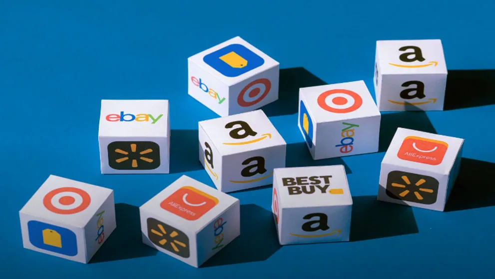 Cubes with logos of ecommerce platforms like eBay and Amazon scattered on a blue surface.