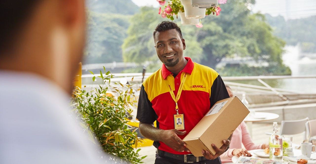 DHL courier holding a parcel