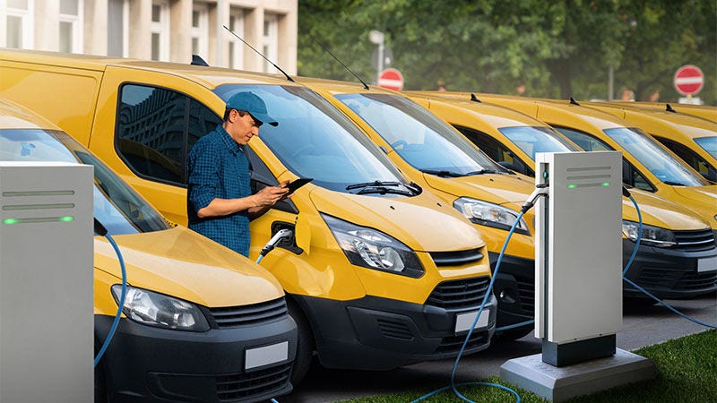 man standing by yellow vans