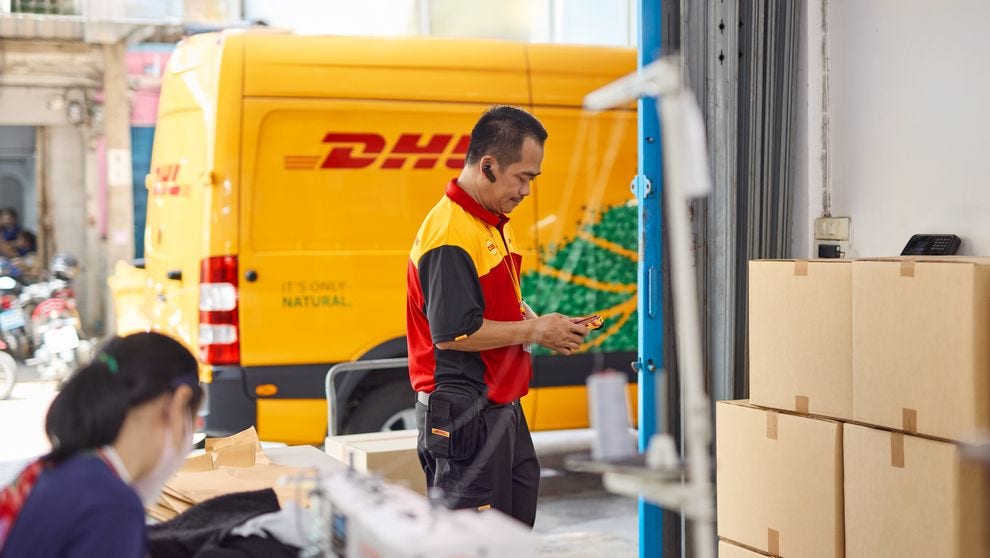 DHL Express electric vehicle fleet picking up deliveries in Bangladesh