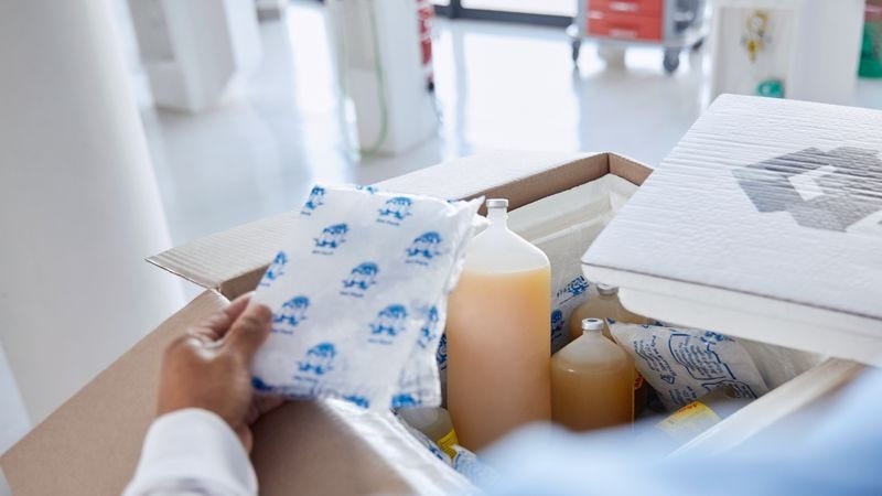 Nurse packs medicine into a parcel.