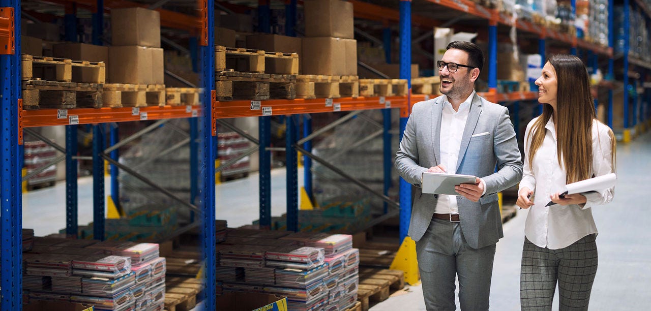 man and woman in warehouse