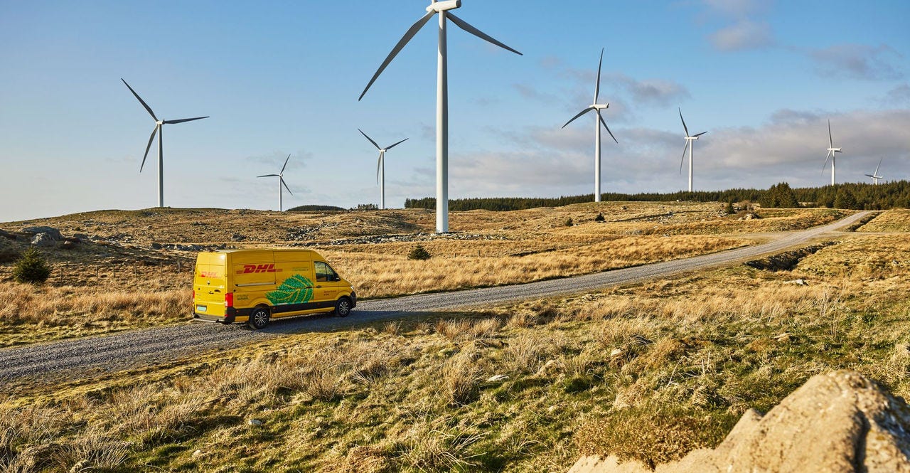 electric dhl express vehicle transporting packages