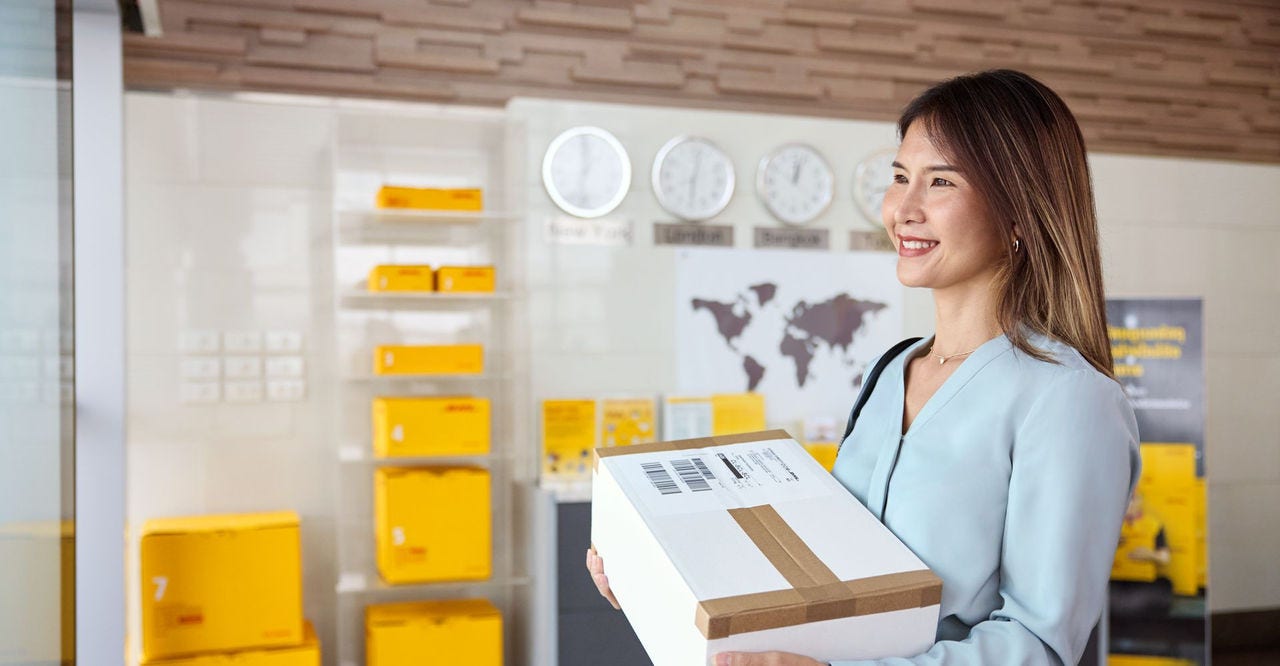 female customer picking up dhl express parcel