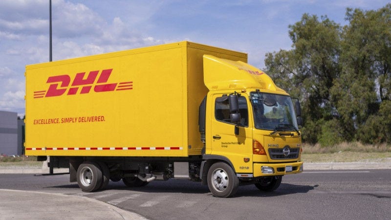 a dhl express truck on the road shipping pcbs from taiwan