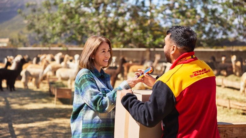 dhl employee handling the delivery of pickle jars from india