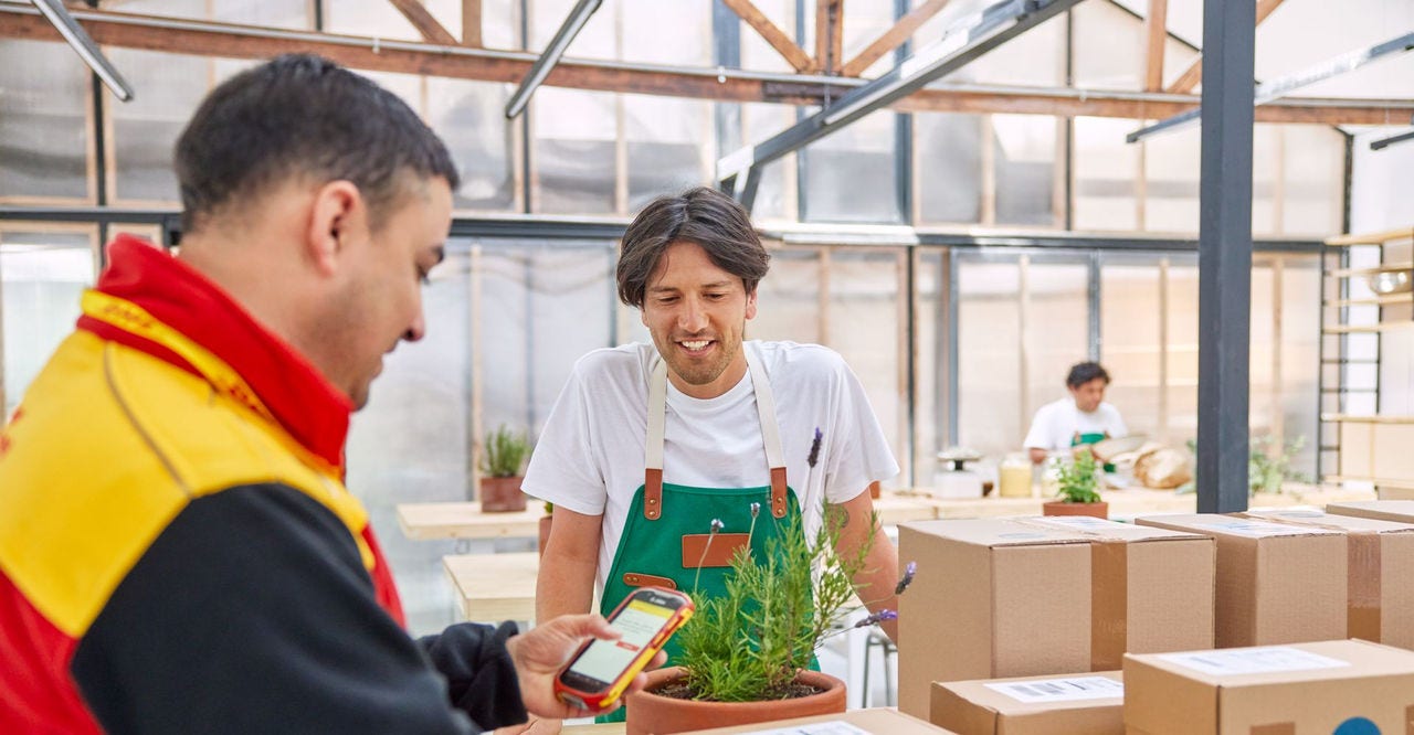a courier and a small business owner discussing how to ship with dhl express