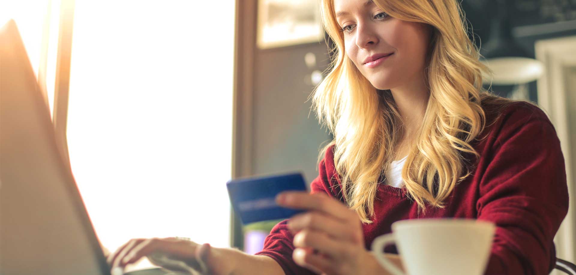 woman holding credit card
