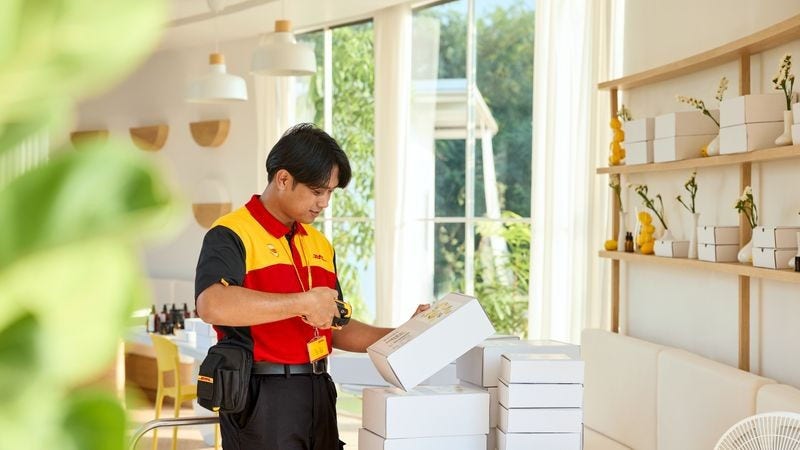 dhl express employee picking up items sold on an e-commerce marketplace