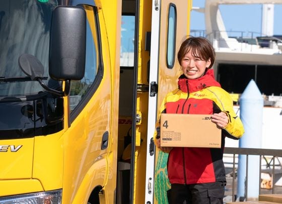 female dhl courier smiling