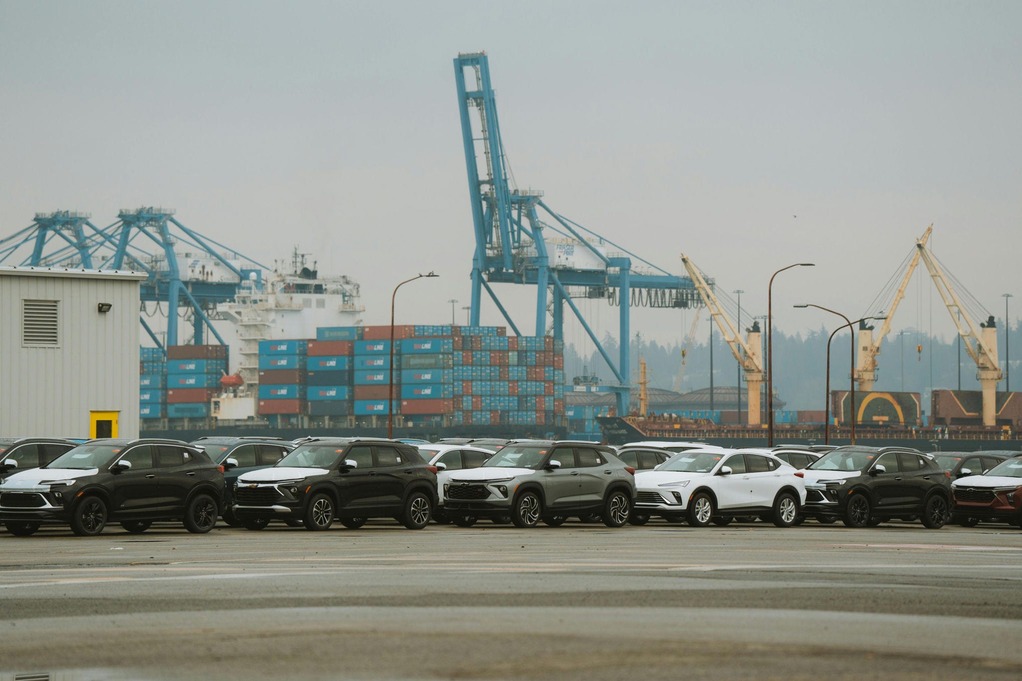 cars parked at an industrial shipping port