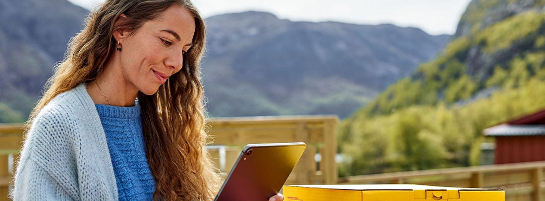 woman looking at tablet screen