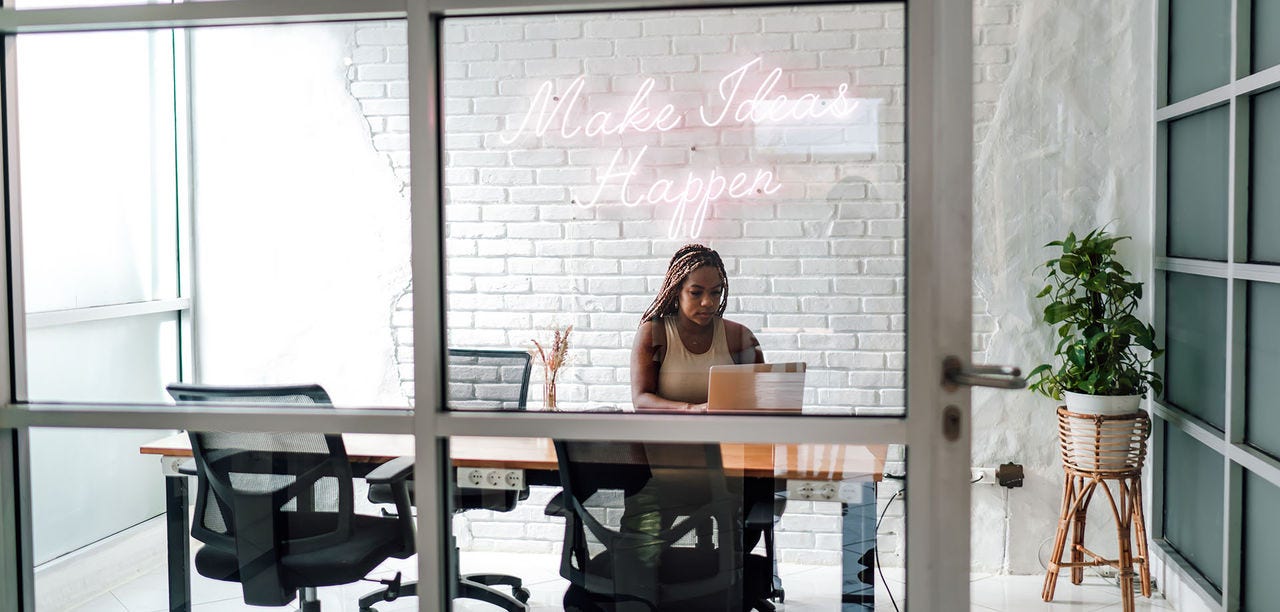 woman typing on a laptop