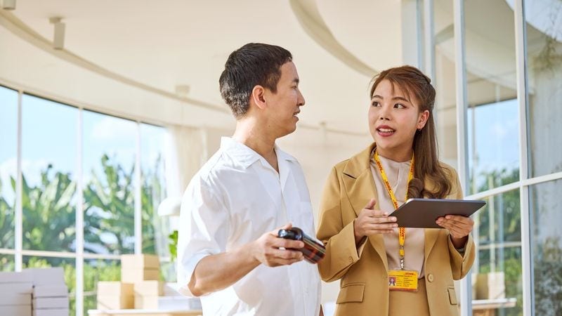 a shop owner discussing with dhl expert about exporting cosmetics