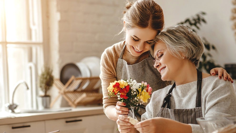 woman giving her mum flowers