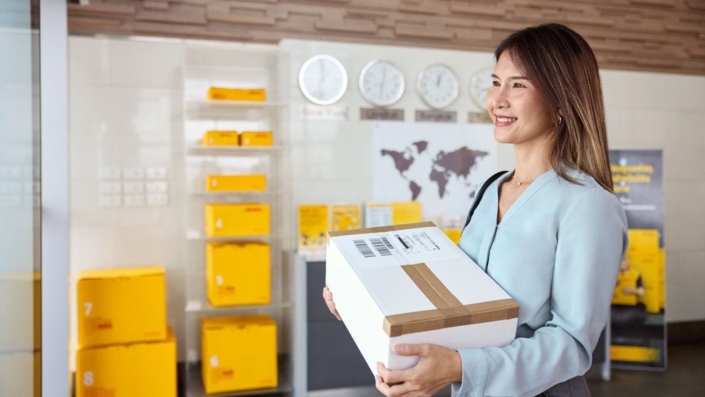 female customer picking up dhl express parcel