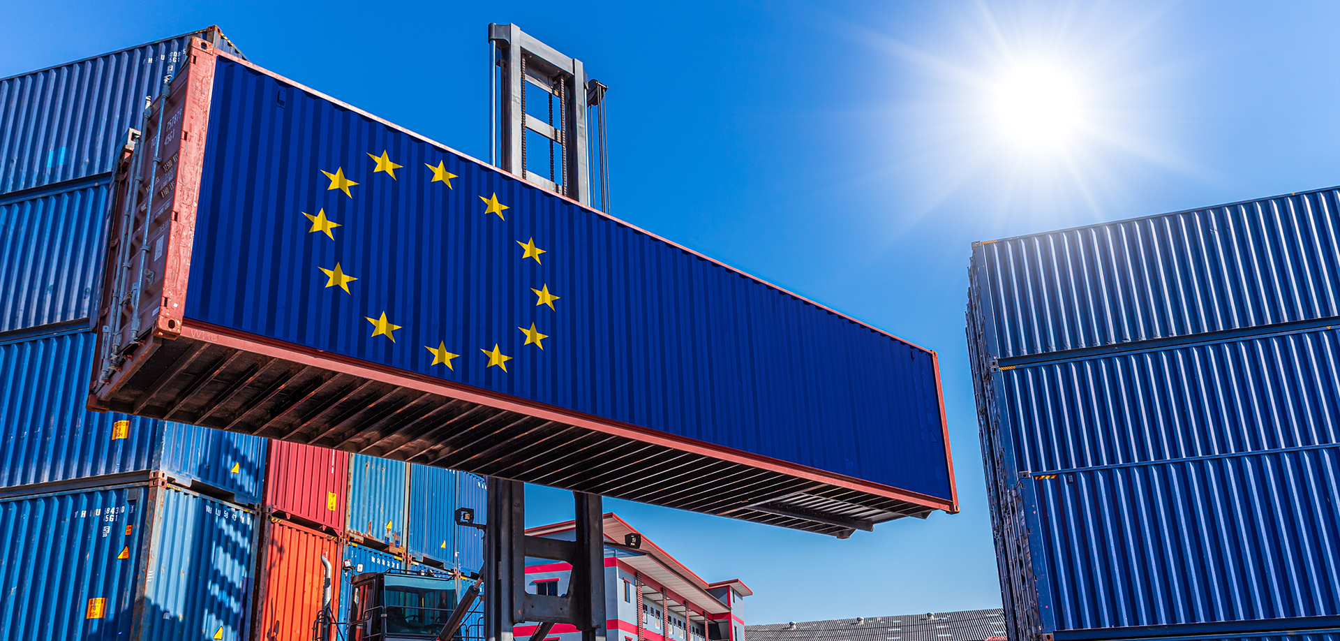 Cargo being prepared for export to the European Union, with containers stacked at a port terminal
