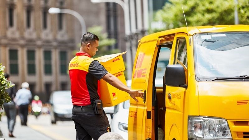 DHL logistics team delivering parcels