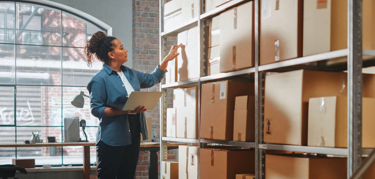 woman reviewing box labels 