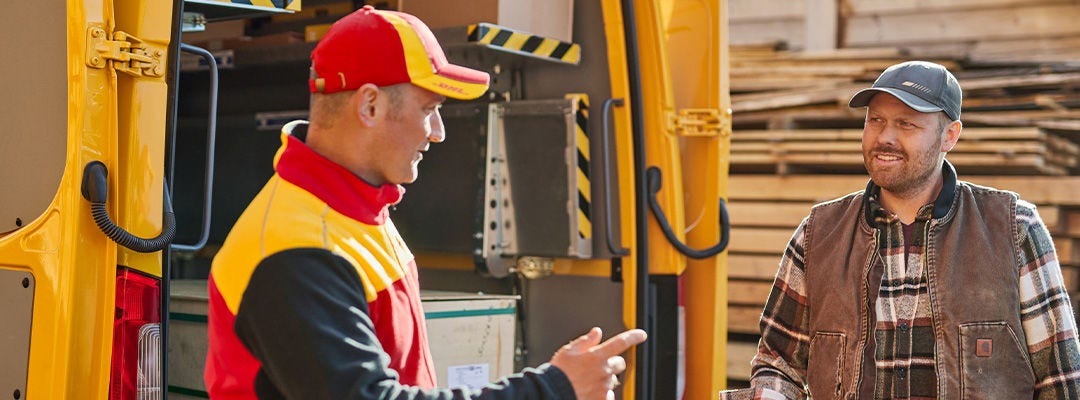 DHL courier speaking to a man in a hat