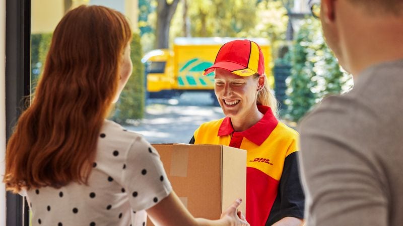 dhl employee delivering parcel box to customer 