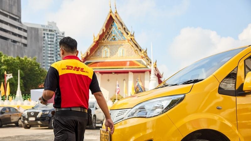 dhl employee ready to make a delivery