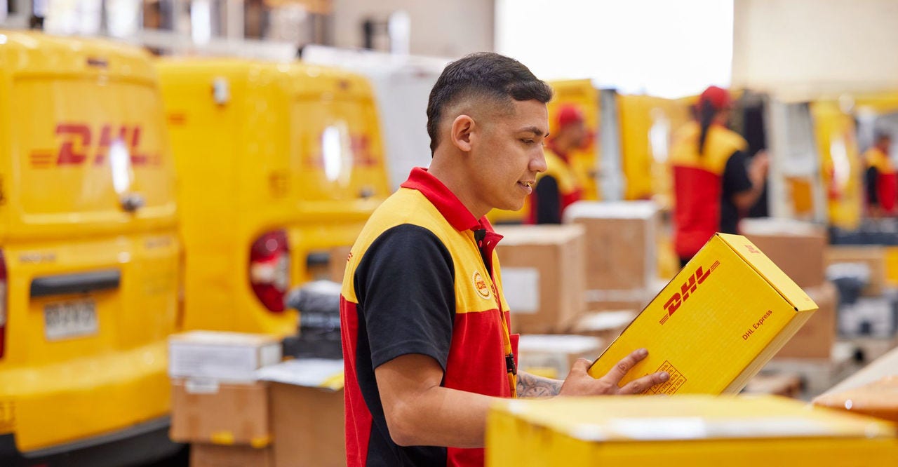dhl express employee handling a parcel filled with thai snacks