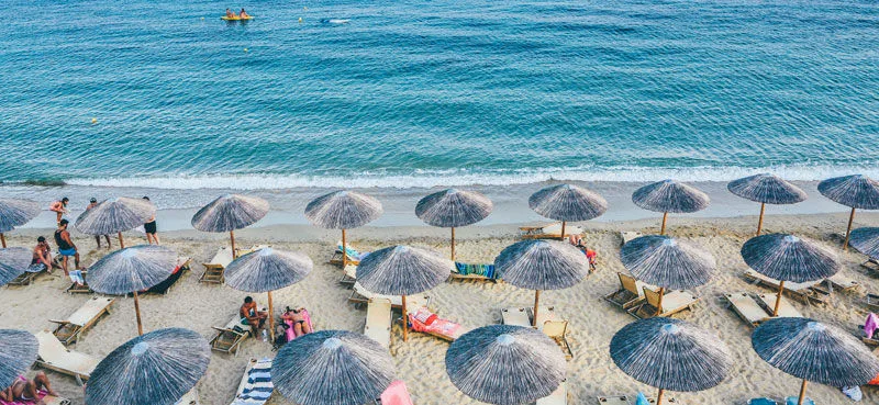 Beach with straw umbrellas