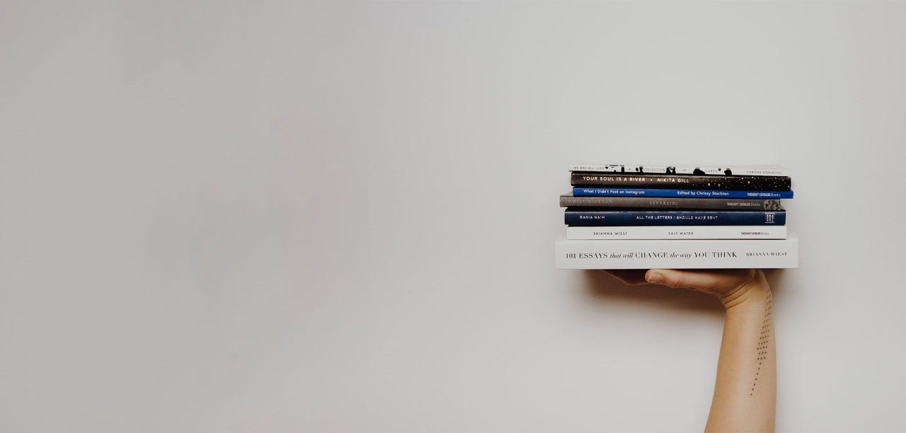 hand holding up books