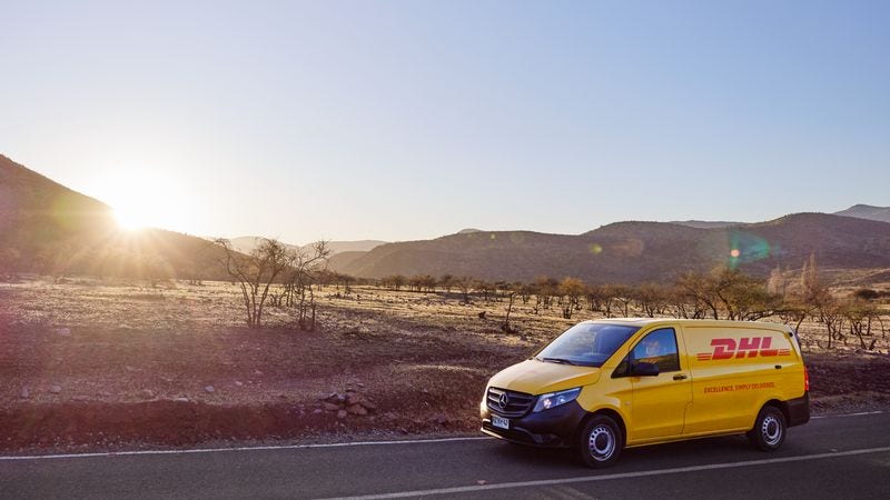dhl express van on a road delivering packages from thailand to kuwait