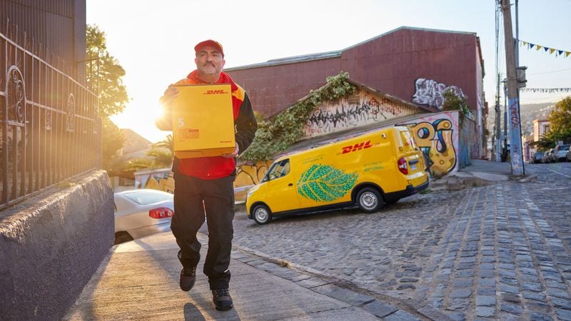 DHL employee delivering an express parcel with care