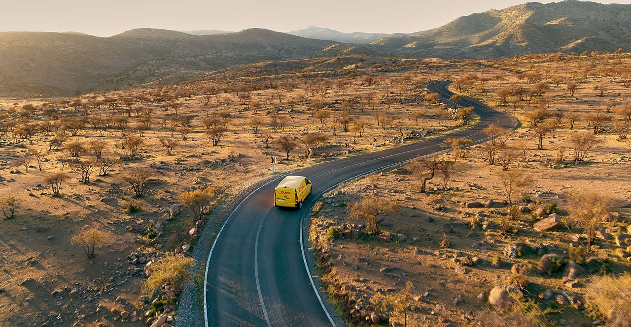 dhl express electric van delivering packages to facilitate global trade