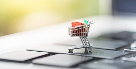 mini shopping cart on a keyboard