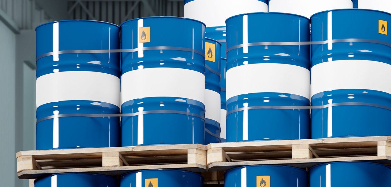 Chemical products in barrels barrels with chemicals on flights. Sea freight container with barrels. Flammable sticker on casks with chemicals. Transportation of toxic products.