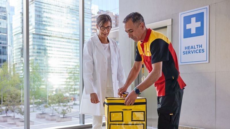 DHL’s medial courier service personnel delivering a parcel