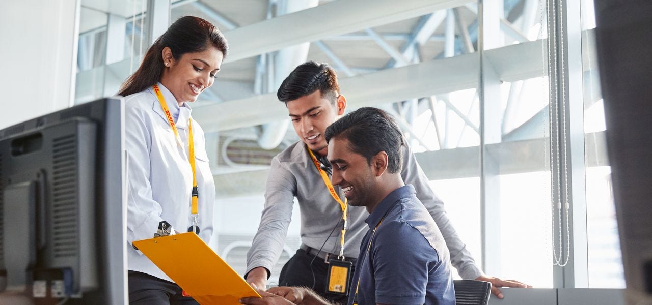 DHL employees talking during a meeting