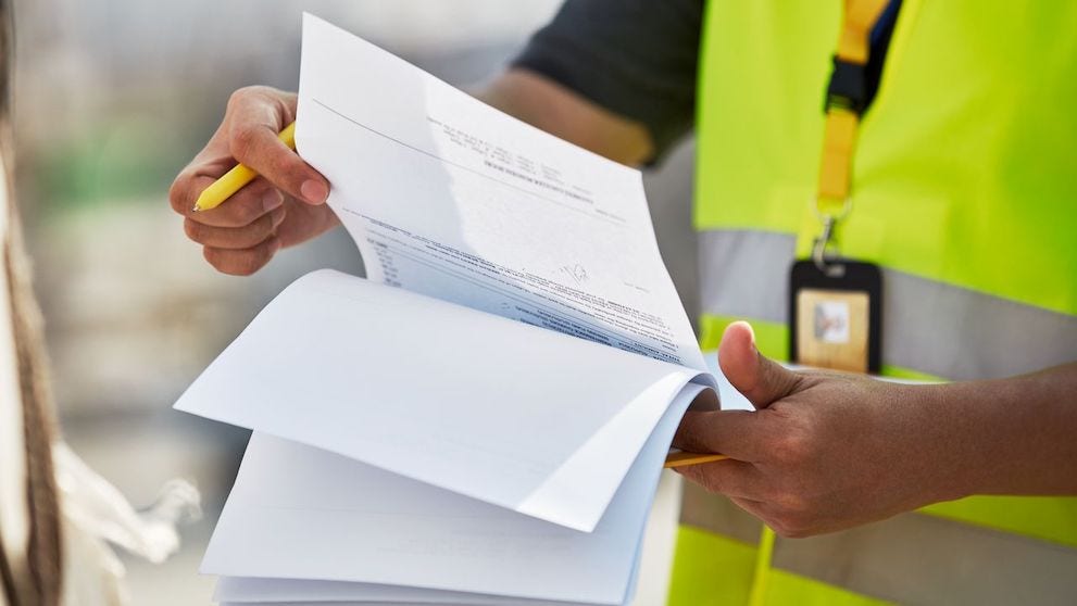 DHL employee with customs documents