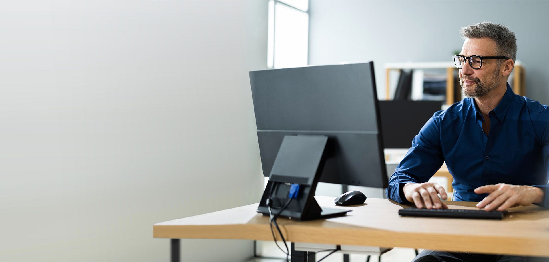 man looking at computer screen