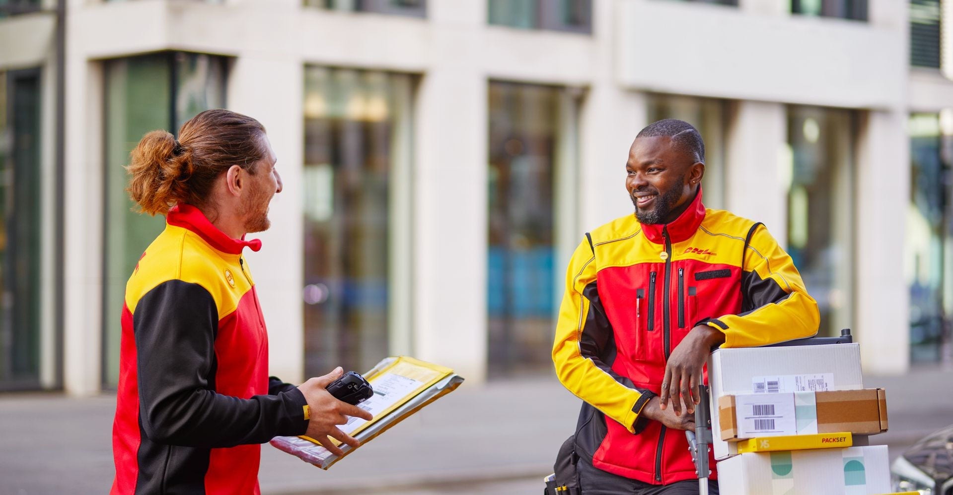 Two DHL employees having a chat.