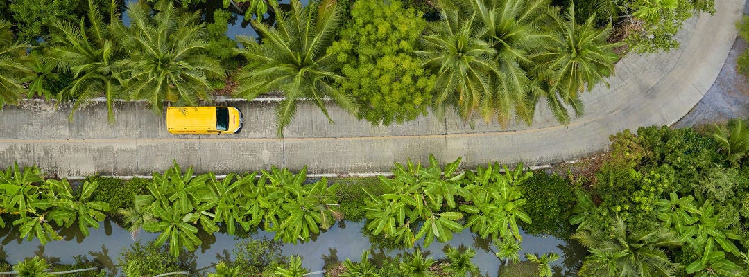 aerial view of yellow van on a road