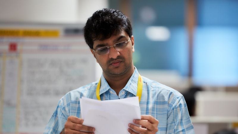 business owner inspecting a report on products returned