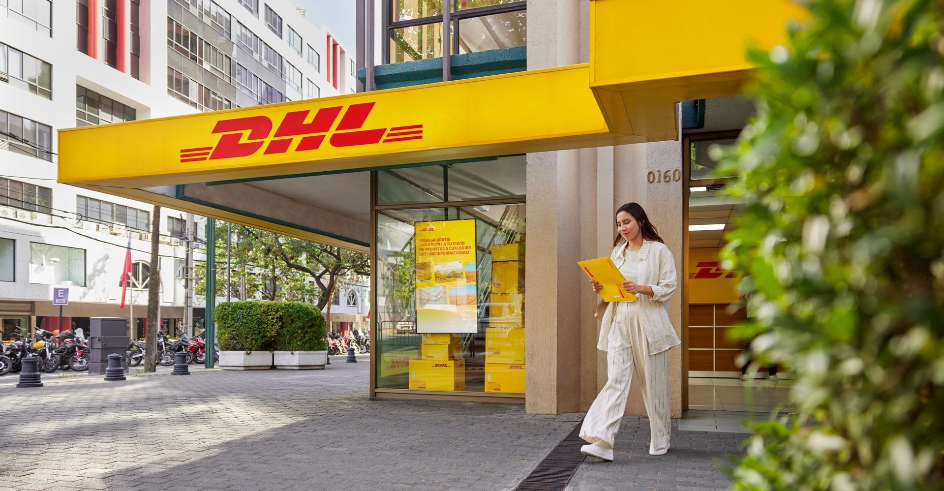 Female customer dropping off her parcel at a DHL Express Service Point in Philippines