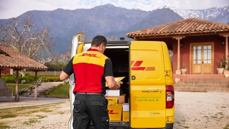 DHL Express employee doing a same-day package delivery in the Philippines