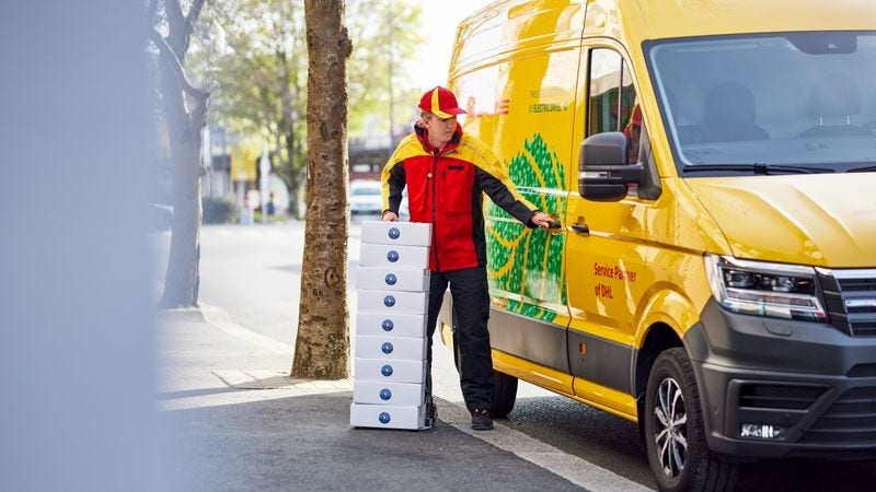 dhl express employee picking up packages for air freight to china