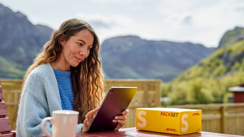 a New Zealand business owner fulfilling an order with the help of DHL