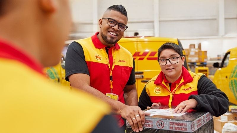 DHL Express employees checking laptop packages